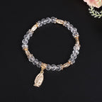 Pulsera de Cuentas de Cristal Transparente con Dije de la Virgen María