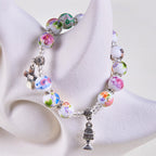 Pulsera de Una Decena de Cuentas de Cerámica de Colores con Santo Cáliz