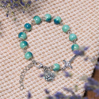 Pulsera de Cuentas de Cerámica Verde con Rosa y Crucifijo "Floración Alegre"