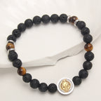 Pulsera de San Benito de Piedra Volcánica y Ojo de Tigre Amarillo