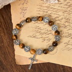 Pulsera de Ojo de Tigre con Símbolo de San Benito: Mezcla de Fe y Belleza