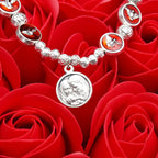 Pulsera de Cuentas de Rosa y Cruz con Espíritu Santo en Esmalte: Símbolo de Protección Bendita