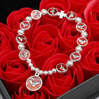 Pulsera de Cuentas de Rosa y Cruz con Espíritu Santo en Esmalte: Símbolo de Protección Bendita