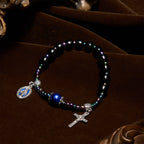 Pulsera de Ébano y Ágata Azul con Medalla de la Virgen y Crucifijo