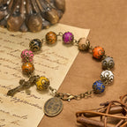 Pulsera Vintage de Cuentas de Colores con San Benito y Crucifijo en Bronce: Confianza en lo Divino
