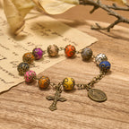 Pulsera Vintage de Cuentas de Colores con San Benito y Crucifijo en Bronce: Confianza en lo Divino
