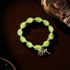 Pulsera de Rosa con Cuentas Verdes Transparentes con Dije de San Judas y Crucifijo