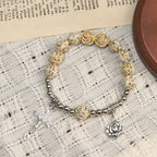 Pulsera Rosario de Cuentas de Rosa Blanca de 10 mm Esculpidas con Crucifijo