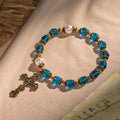 Pulseras Espirituales de Cuentas Azules Brillantes con Crucifijo Sagrado de Latón