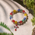 Pulseras de Cristal con Motas Doradas que Brillan en la Oscuridad con Crucifijo