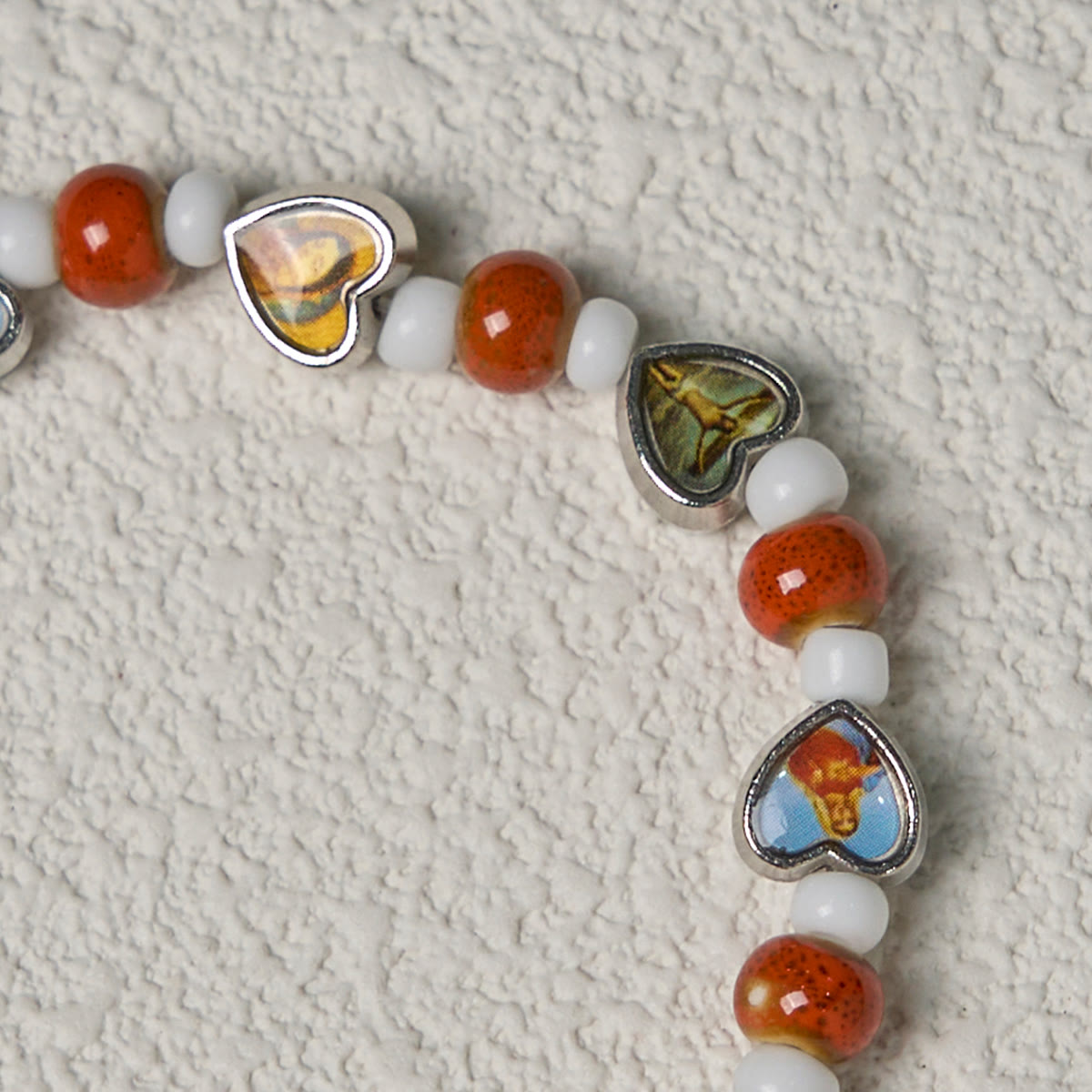 Pulseras de Cuentas de Cristal y Cerámica de Colores con Cruz y Dijes de Santos