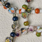 Pulseras de Cuentas de Cristal y Cerámica de Colores con Cruz y Dijes de Santos