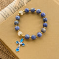 Pulsera Serena de Piedra Azul Texturizada con Crucifijo de Esmalte Azul