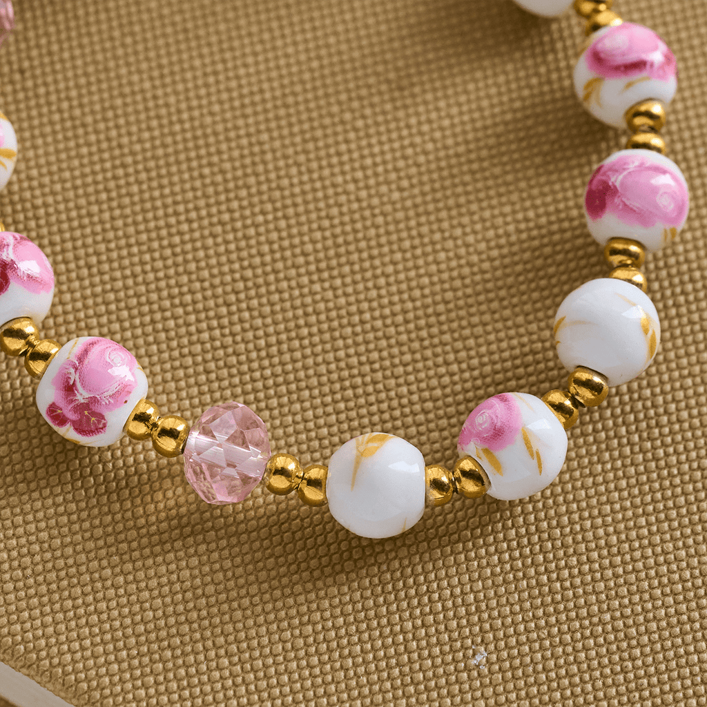 Pulsera Elegante de Cerámica Rosa de 8 mm con Patrón Floral y Medalla Milagrosa