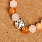 Pulsera de Cuarzo Naranja y Blanco con Dijes de Gato Atigrado en Acero, Rosario Animal