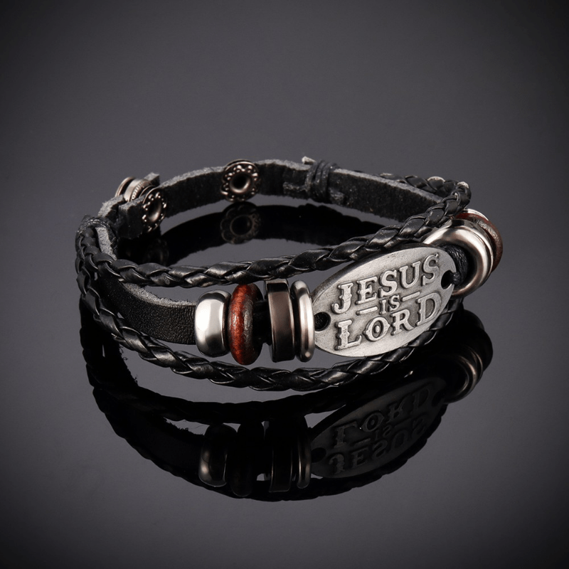 Pulsera de Cuero Trenzado Negro con Inscripción "JESÚS ES EL SEÑOR"