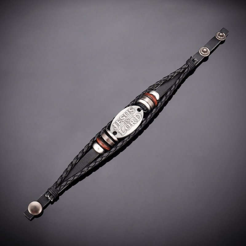 Pulsera de Cuero Trenzado Negro con Inscripción "JESÚS ES EL SEÑOR"