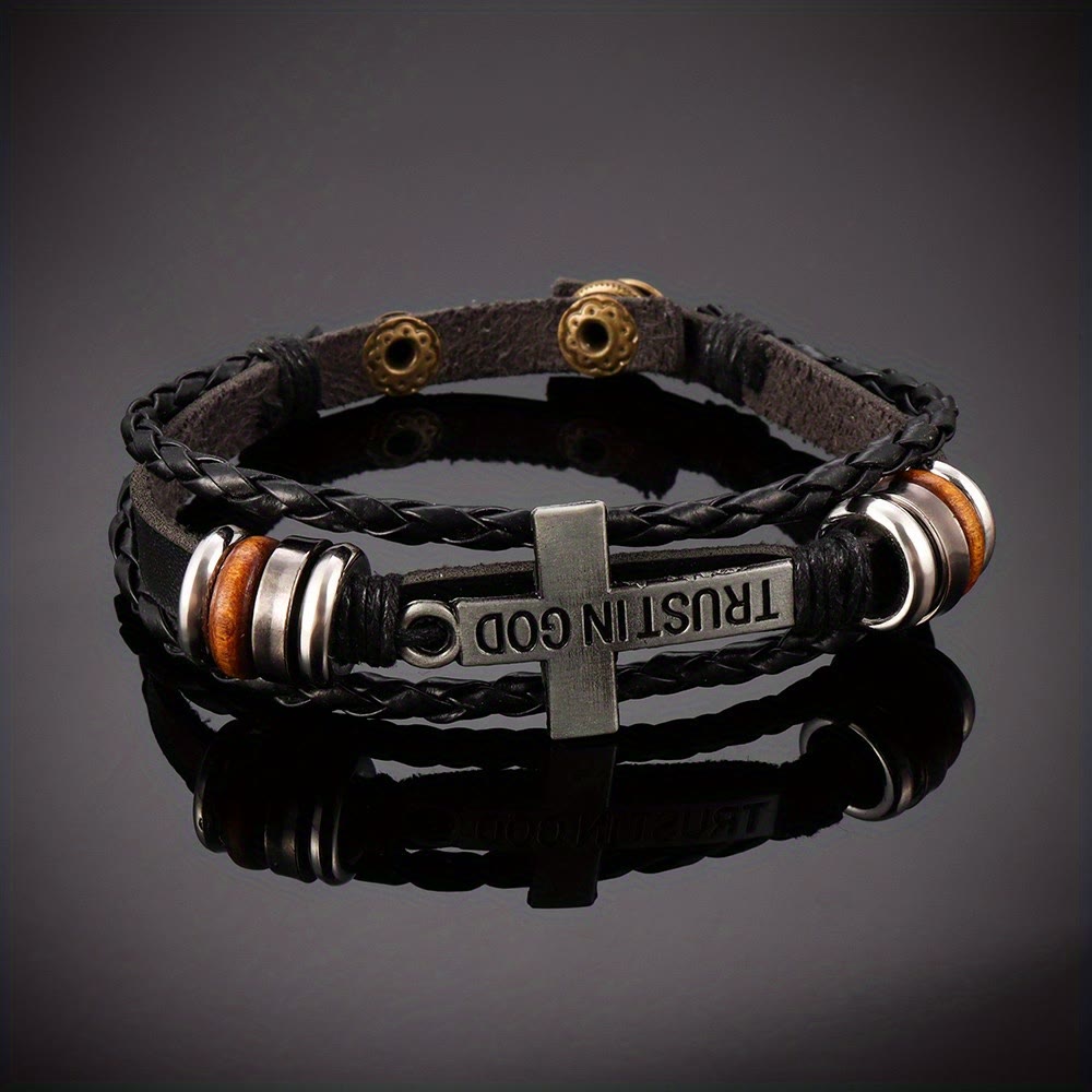 Pulsera de Cuero Trenzado Negro con Cruz e Inscripción "CONFÍA EN DIOS"