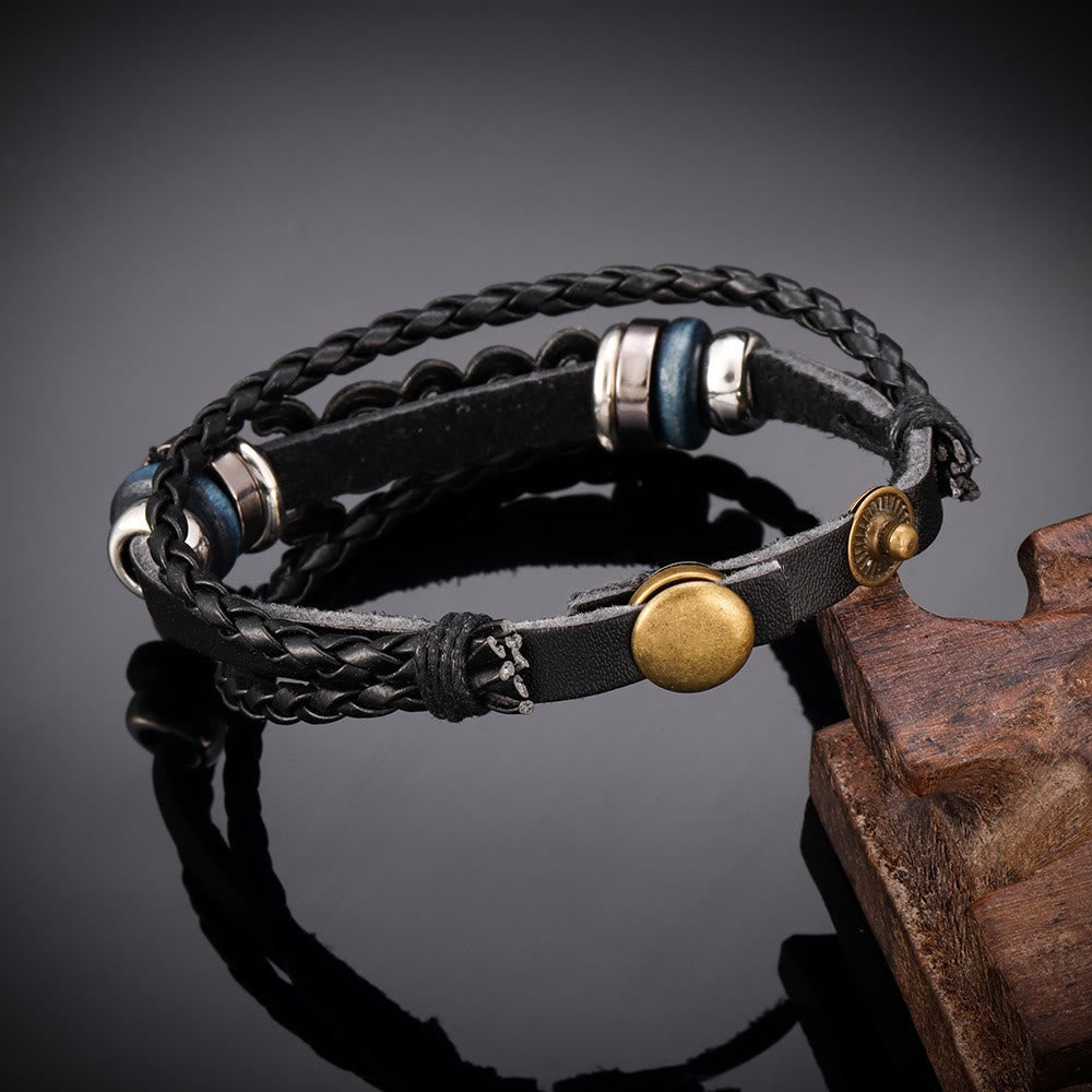 Pulsera de Cuero Trenzado Negro con Dije de Jesús en Dos Tonos