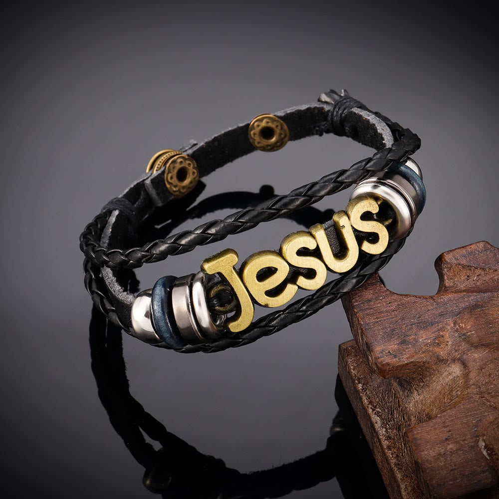 Pulsera de Cuero Trenzado Negro con Dije de Jesús en Dos Tonos