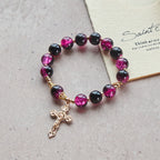 Pulsera de Cuentas de Cristal Negro y Rosa "Gracia y Fuerza" con Cruz Dorada