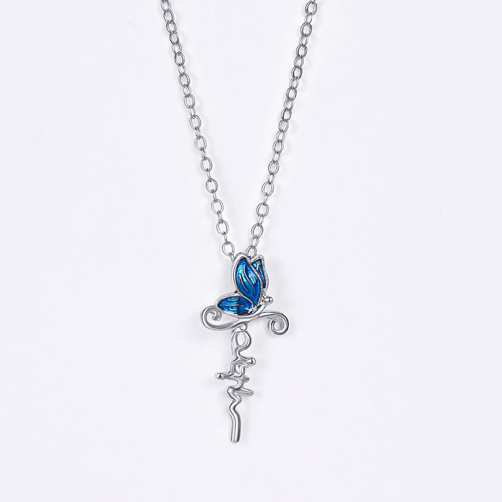 Set de Joyería de Cruz y Mariposa: Devoción y Simbolismo con Arte