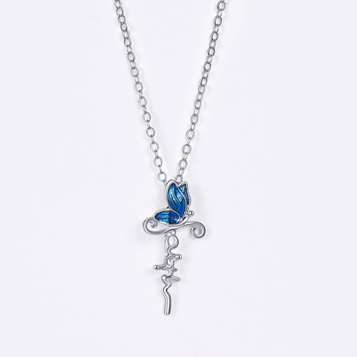Set de Joyería de Cruz y Mariposa: Devoción y Simbolismo con Arte
