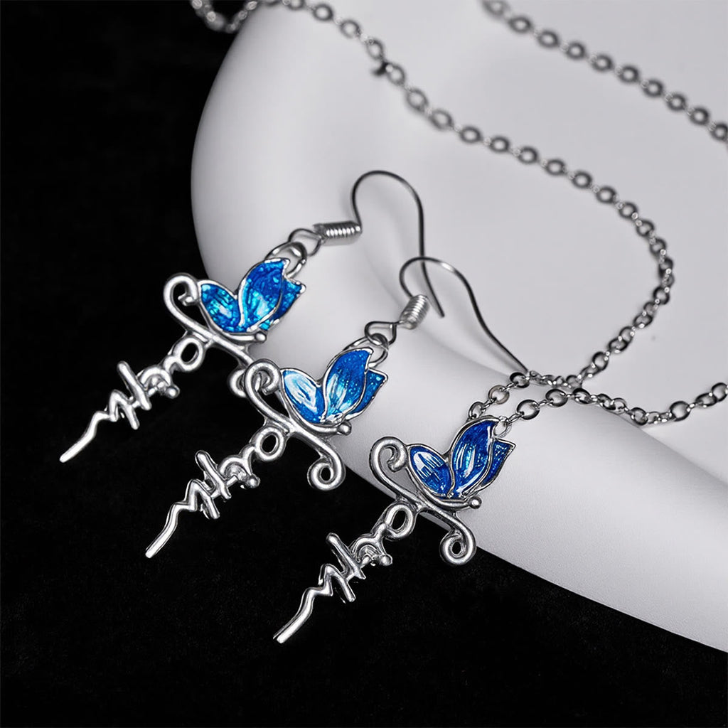 Set de Joyería de Cruz y Mariposa: Devoción y Simbolismo con Arte