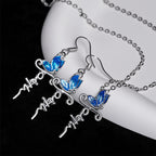 Set de Joyería de Cruz y Mariposa: Devoción y Simbolismo con Arte