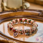 Pulsera de Cuentas Rojas de Esmalte con Dije de Corazón y Cruz
