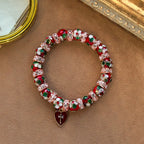 Pulsera de Cuentas Rojas de Esmalte con Dije de Corazón y Cruz