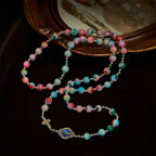 Pulsera Rosario de 6 mm con Brillo UV en Tonos Pastel: Devoción Iluminada