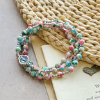 Pulsera Rosario de 6 mm con Brillo UV en Tonos Pastel: Devoción Iluminada
