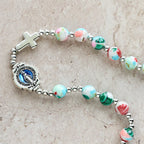 Pulsera Rosario de 6 mm con Brillo UV en Tonos Pastel: Devoción Iluminada