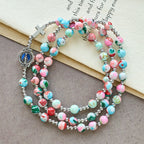 Pulsera Rosario de 6 mm con Brillo UV en Tonos Pastel: Devoción Iluminada