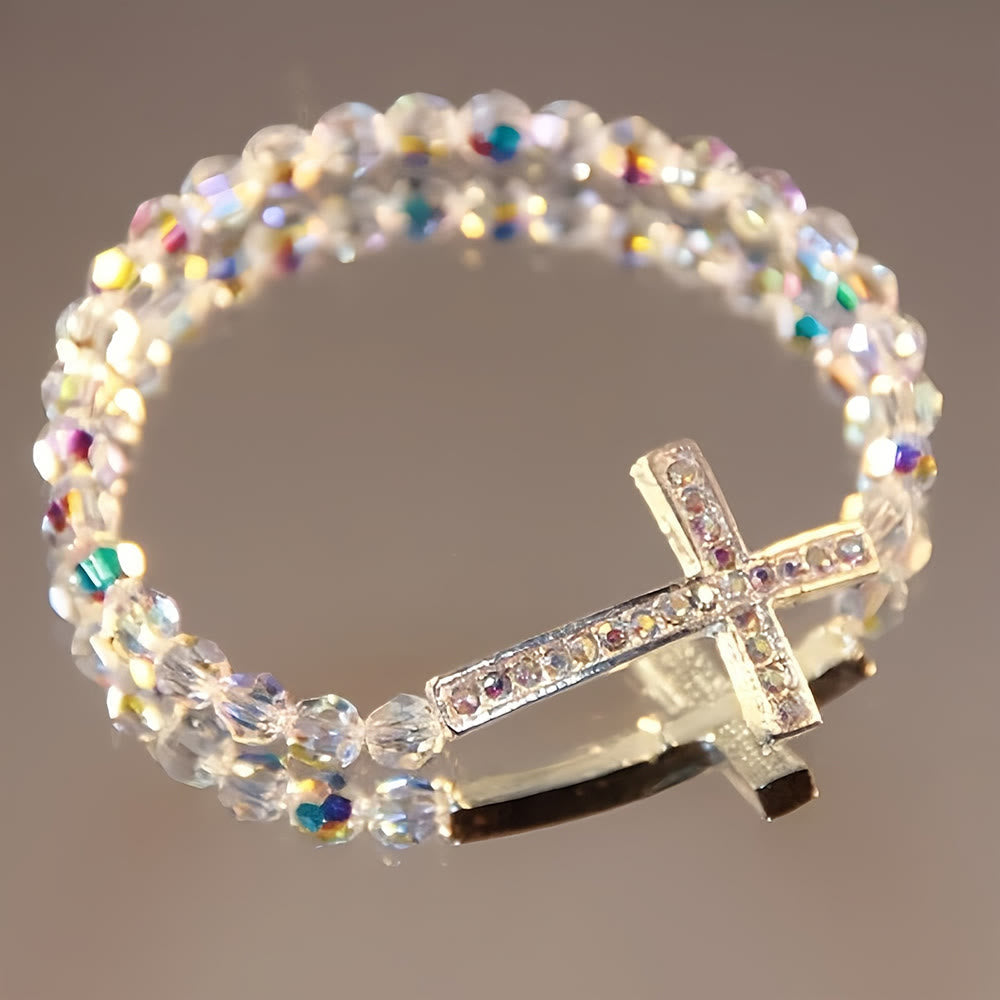 Pulsera de Cruz Blanca y Azul Pavo Real: Fe Envuelta en Brillo