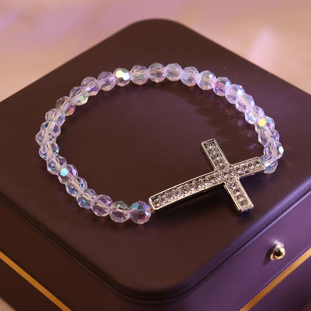 Pulsera de Cruz Blanca y Azul Pavo Real: Fe Envuelta en Brillo