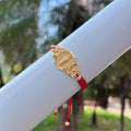Pulsera de la Virgen de Varios Cordones: Recordatorio de Su Cuidado
