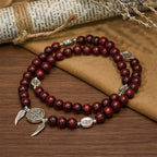 Pulsera de Cuentas de Sándalo Rojo con Medalla Milagrosa y Ala de Ángel