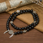 Pulsera de Cuentas de Sándalo Rojo con Medalla Milagrosa y Ala de Ángel