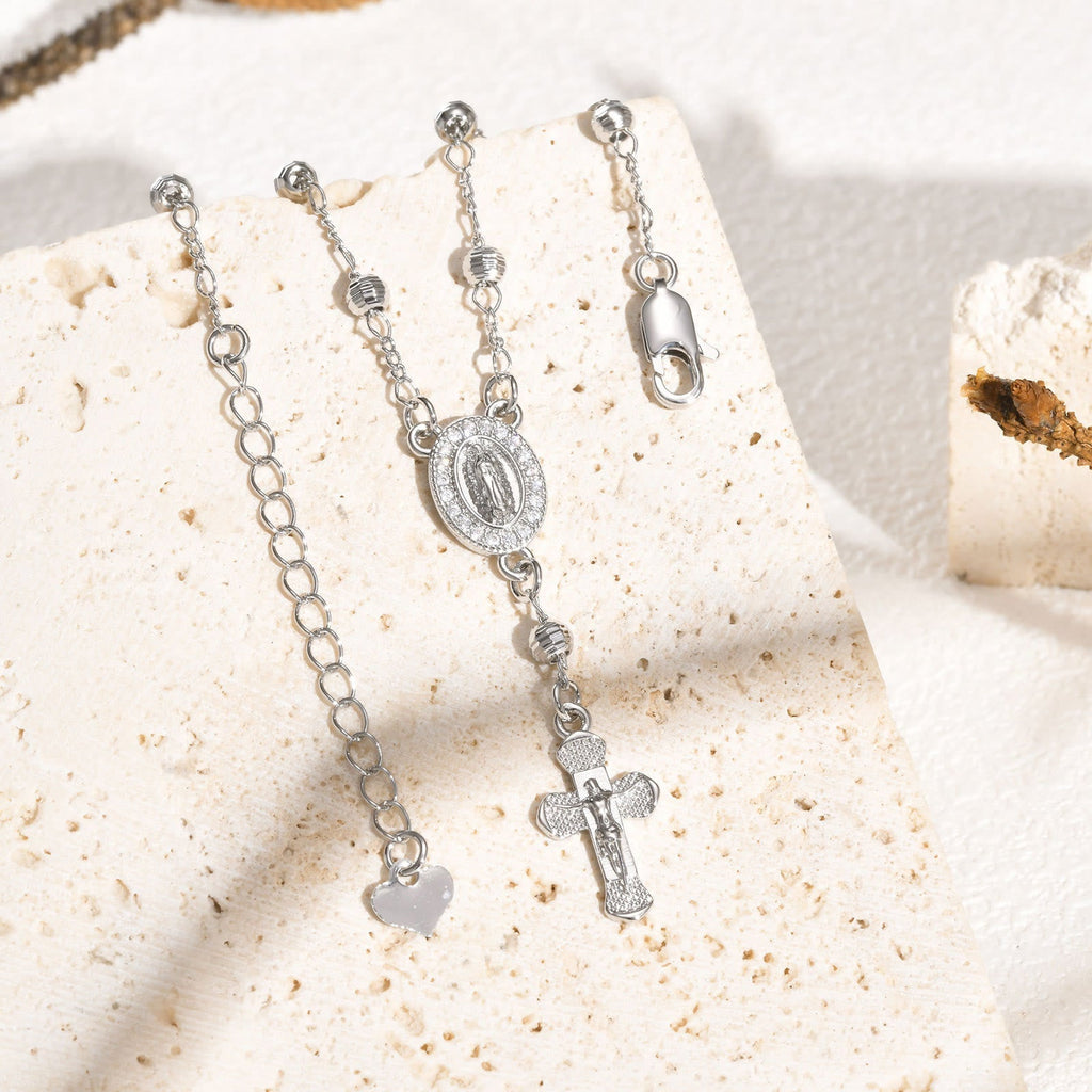 Pulsera con Dije de la Virgen y Crucifijo: Su Gracia en tu Muñeca