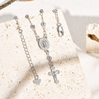 Pulsera con Dije de la Virgen y Crucifijo: Su Gracia en tu Muñeca
