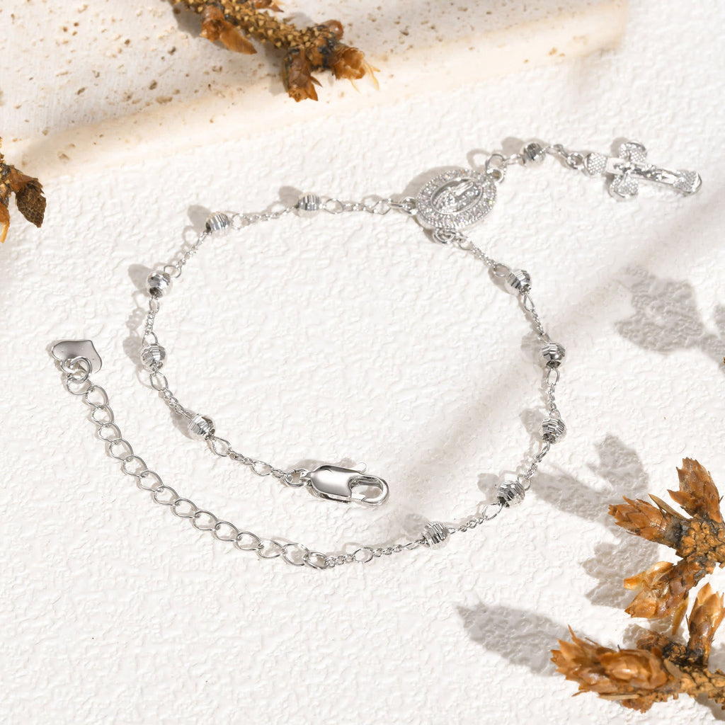 Pulsera con Dije de la Virgen y Crucifijo: Su Gracia en tu Muñeca