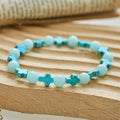 Pulsera de Cruz de Turquesa con Perlas Luminosas