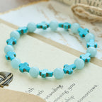 Pulsera de Cruz de Turquesa con Perlas Luminosas