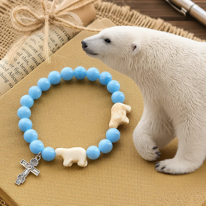 Pulsera Artesanal de Cruz con Cuentas Azules Oso Polar: Salvemos a los Osos Polares