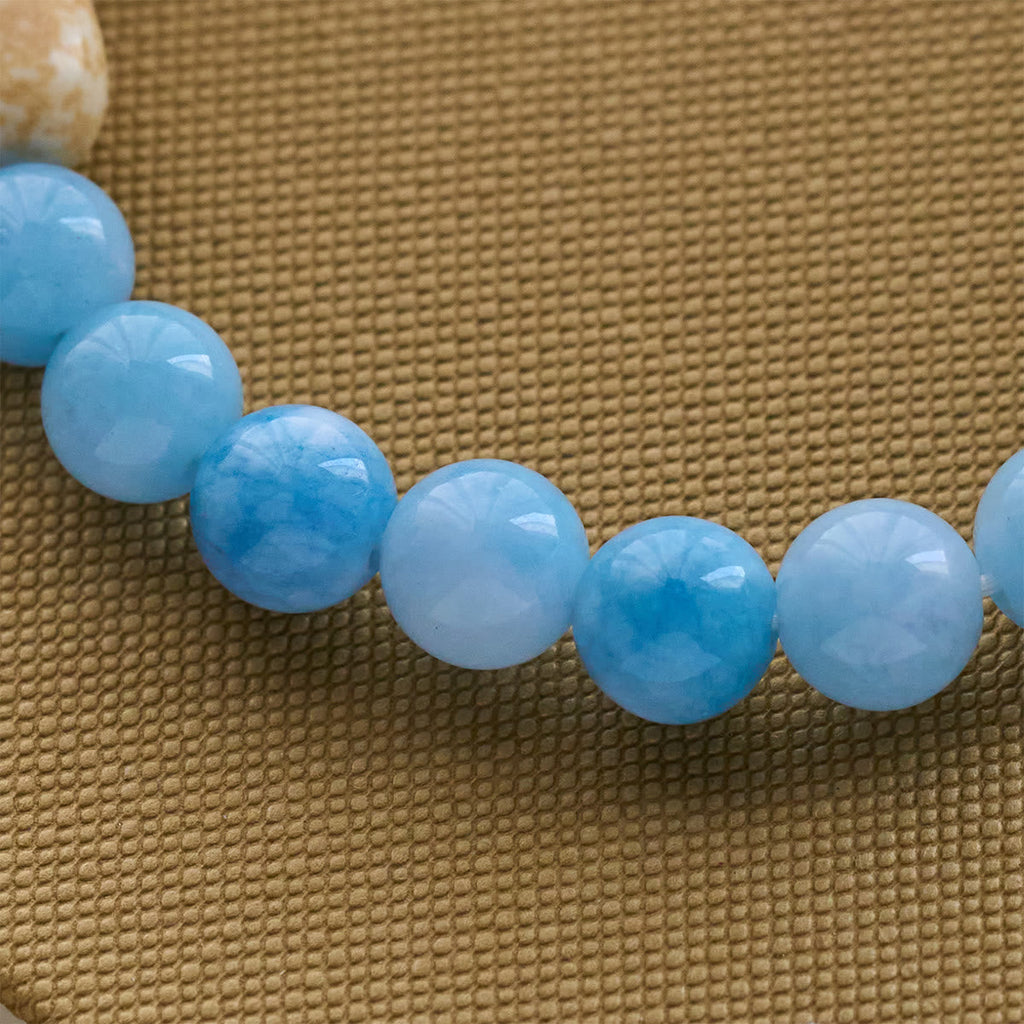 Pulsera Artesanal de Cruz con Cuentas Azules Oso Polar: Salvemos a los Osos Polares