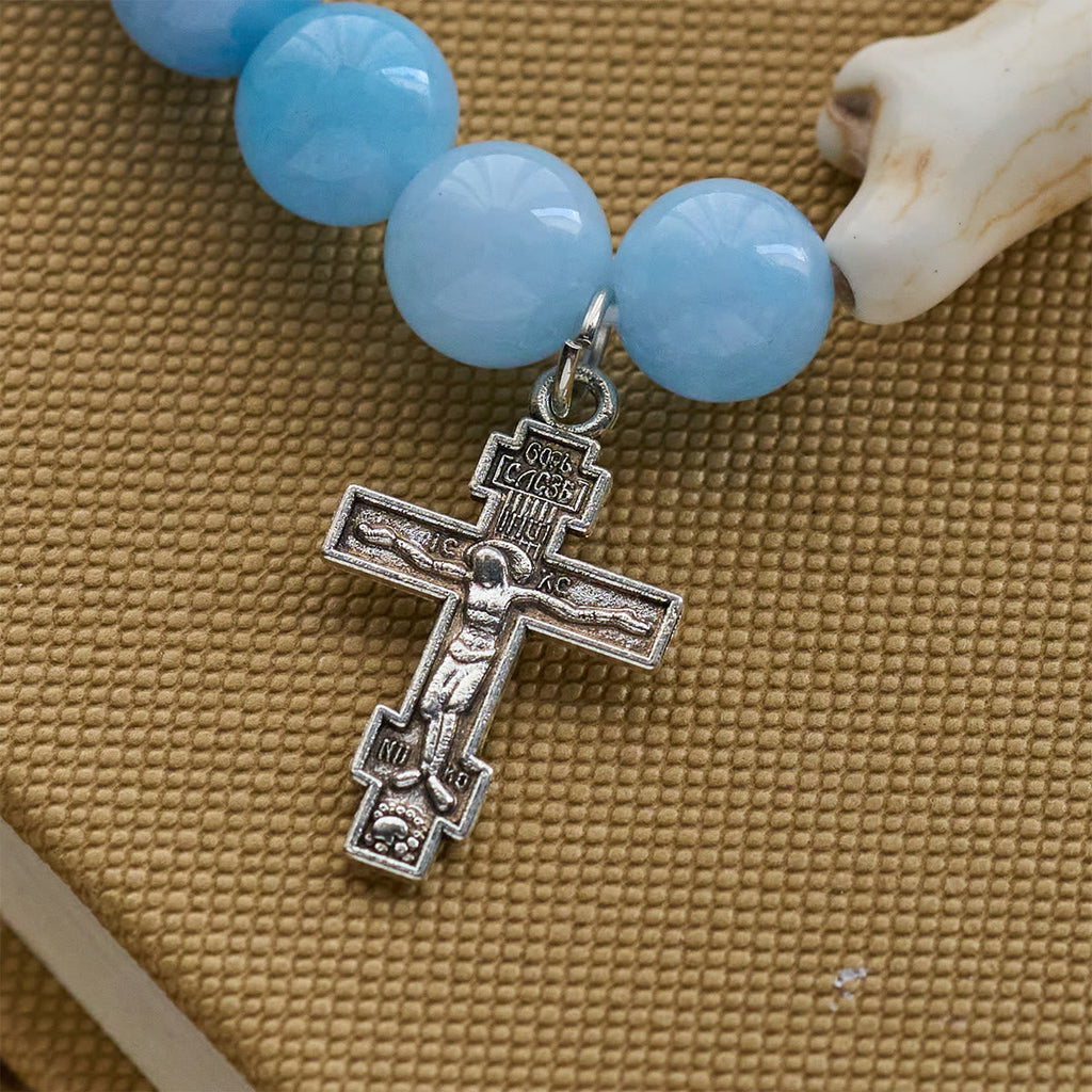 Pulsera Artesanal de Cruz con Cuentas Azules Oso Polar: Salvemos a los Osos Polares