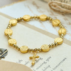 Pulsera Elástica de Cruz de San Benito Tono Oro