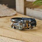 Pulsera Ancha de Cuero Negro Colección San Benito con Múltiples Diseños de Fe